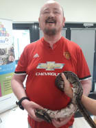 Service user holding snake.